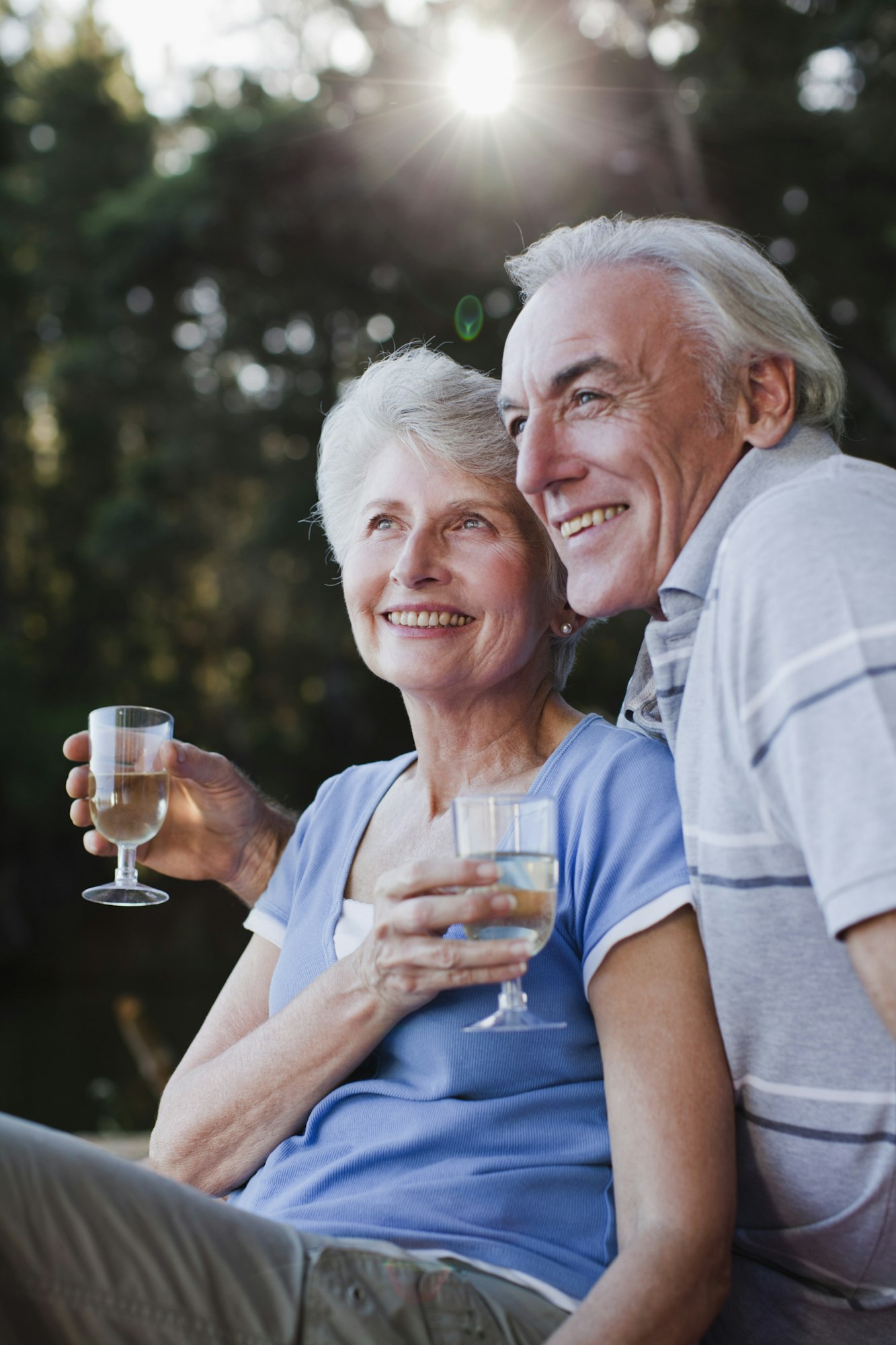 Older couple drinking wine outdoors